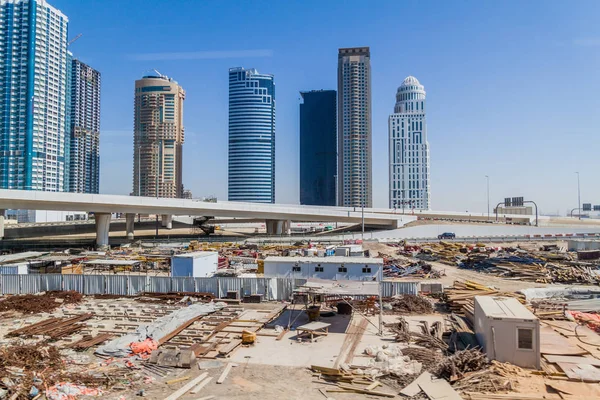 Skyscrapers and a construction site in Dubai, United Arab Emirates.