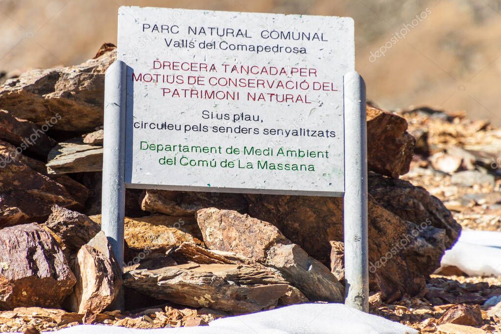 Information board in Parc Natural Comunal de les Valls del Comapedrosa national park in Andorra It says: walk on the marked trails.