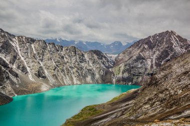 Ala-Kul lake in the Terskey Alatau mountain range in Kyrgyzstan clipart