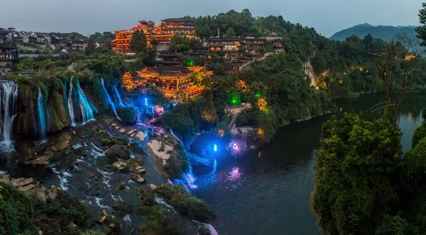 Evening view of Furong Zhen town and waterfall, Hunan province, China