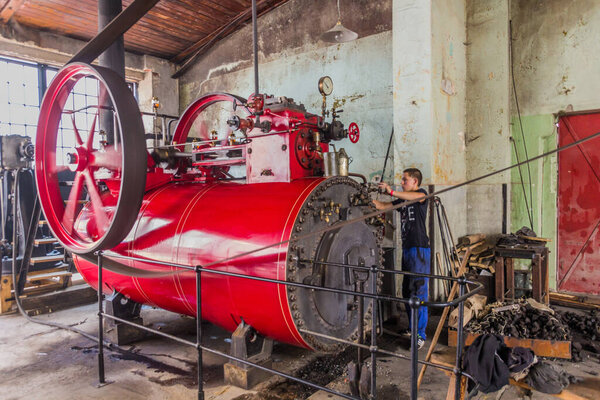 ZAMBERK, CZECHIA - SEPTEMBER 15, 2018: Running steam engine in the Old Machines and Technologies Museum (Muzeum starych stroju a technologii) in Zamberk, Czechia.