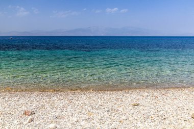 Pebble beach of the Gulf of Corinth, Greece