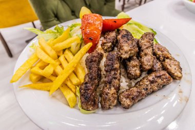 Meal in Turkey - disk of inegol meatballs with rice and French fries