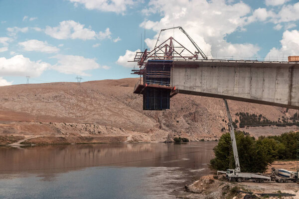 Construction of a bridge over Euphrates (Firat) river under the Ataturk dam, Turkey