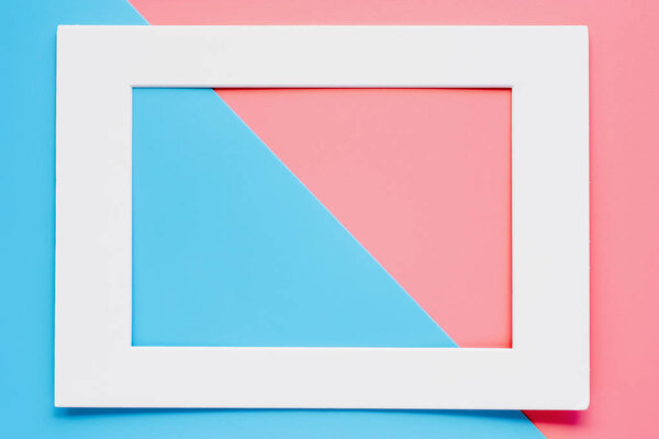White paper frame on pink and blue pastel color background