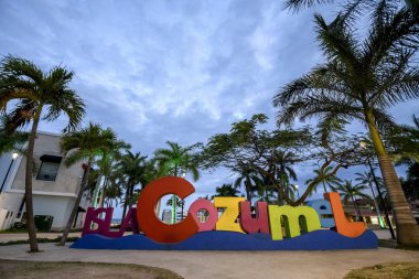 The Cozumel selfie sign at dusk on the main square of the island in Mexico clipart