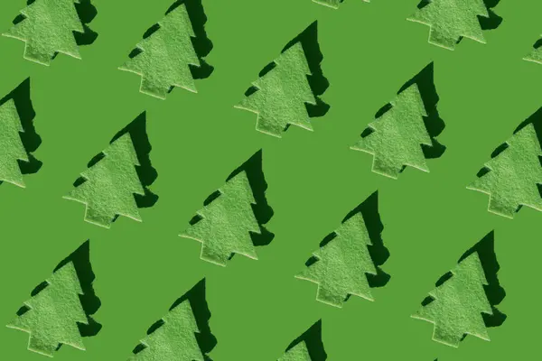 Yeşil Zemin Üzerinde Sıralanmış Yeşil Noel Ağaçları Boyutlu Oluşturma — Stok fotoğraf