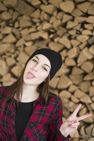 Portrait Young Woman Sticking Out Tongue While Showing Victory Sign — Stock Photo, Image