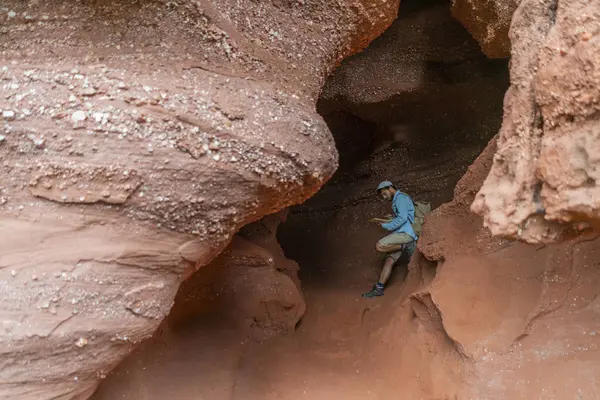 Young Man Sitting Cave Looking Map — Stock Photo, Image