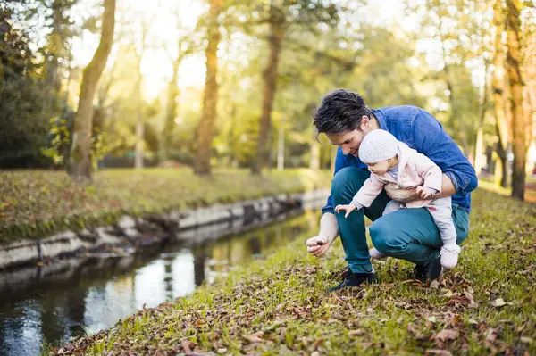 Father Searching Chestnuts Park Baby Daughter His Lap — Stock Photo, Image