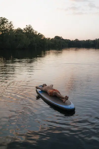 Man Lying Sup Board Lake Sunset — Stock Photo, Image