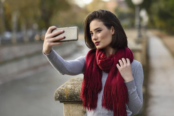 Portrait Young Woman Wearing Red Scarf Taking Selfie Cell Phone — Stock Photo, Image