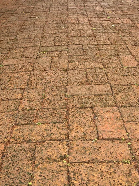 Brick footpath background close up