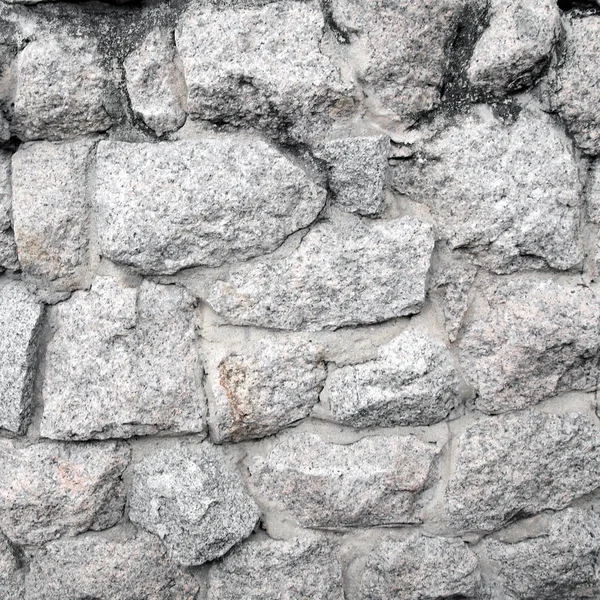 monochrome shot of stone wall texture background