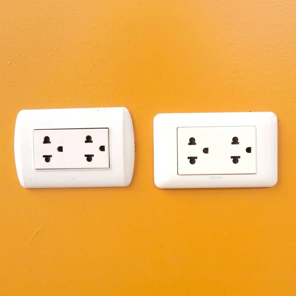 White Electric Outlet Mounted Orange Wall — Stock Photo, Image