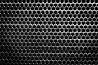 küçük yuvarlak delikli siyah beyaz çelik yüzey