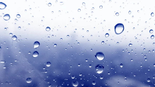Water droplets texture on blue background — Stock Photo, Image