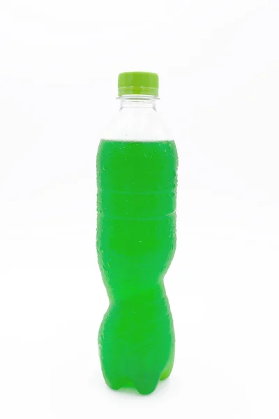 Green color plastic bottle with juice on white background — Stock Photo, Image
