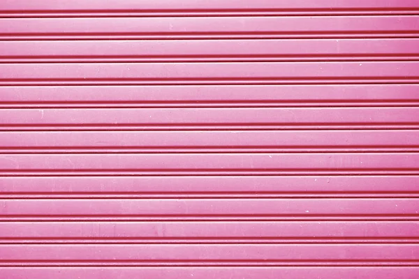 Cink lemez rózsaszín háttér közelről — Stock Fotó