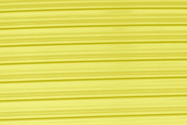 Zinc plate yellow background close up — Stock Photo, Image