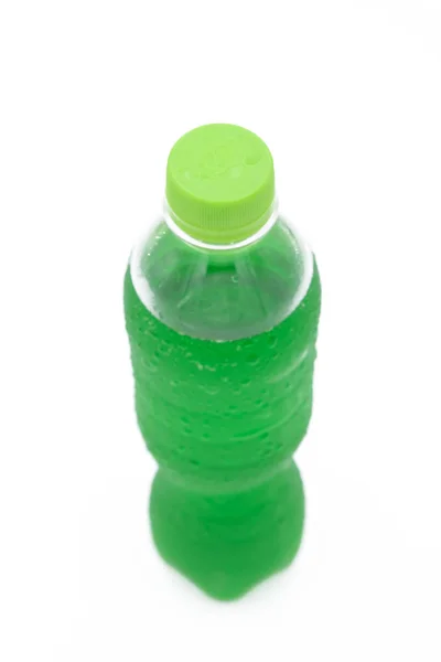 Green color plastic bottle with juice on white background — Stock Photo, Image