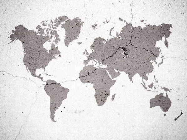 Colore marrone mappa del mondo su sfondo crepa muro di cemento — Foto Stock
