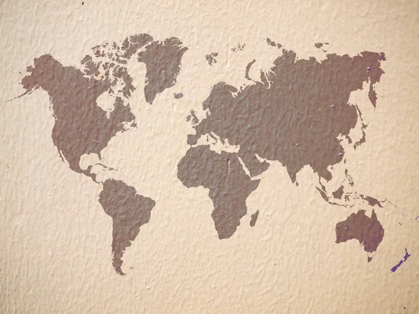 混凝土墙背景上的棕色世界地图 — 图库照片