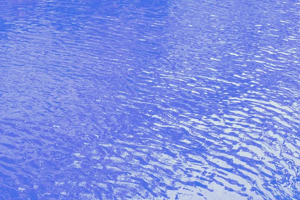 Zavřít oceán vody pozadí, modrá voda vlnky textury — Stock fotografie