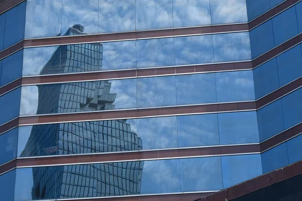 Downtown skyscrapers disctrict with mirror blue sky reflection — Stock Photo, Image