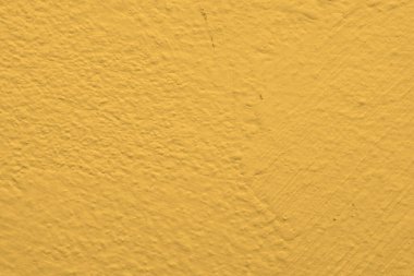 Katı sarı beton desenli duvar