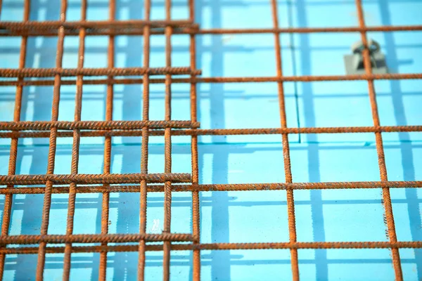 Floor thermal insulation and Wire mesh steel Rebars for reinforced concrete.Floor heating insulation, warm house, eco friendly insulation. Steel reinforcement bar texture in construction site. Iron rods.