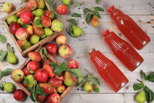 Apple and pear cider, juice, fruit drink and ingredients on a sunny table, home canning. The concept of diet and weight loss. Apples help cleanse the body. Healthy eating, selective focus