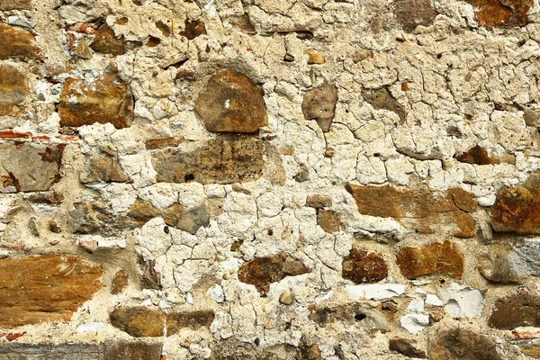 Alte verwitterte Steinmauer — Stockfoto