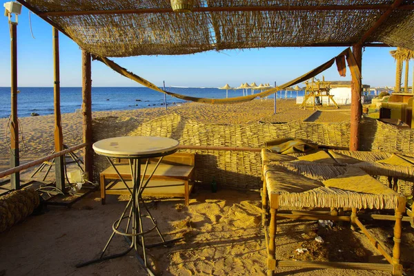 Old Abandoned Beach Furniture Empty Seashore Background Yellow Sand Blue — Stock Photo, Image