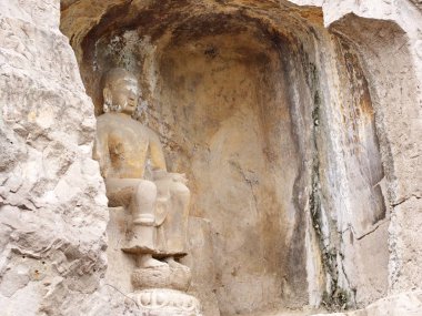 Luoyang Longmen mağaraları. Kırık Buda ve taş mağaralar ve 