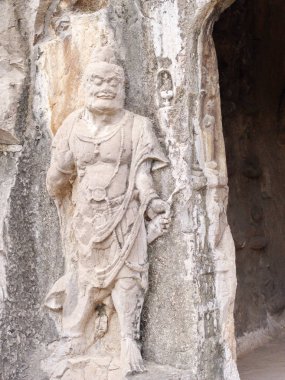 Luoyang Longmen mağaraları. Kırık Buda ve taş mağaralar ve 