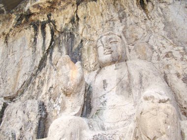 Luoyang Longmen mağaraları. Kırık Buda ve taş mağaralar ve 