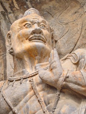 Luoyang Longmen mağaraları. Kırık Buda ve taş mağaralar ve 