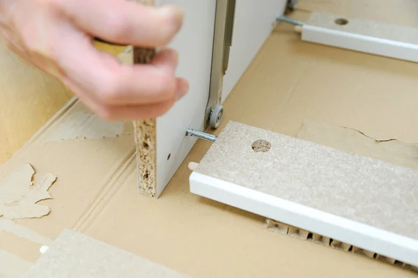 Man Assembling Furniture Chipboard Boards — Stock Photo, Image