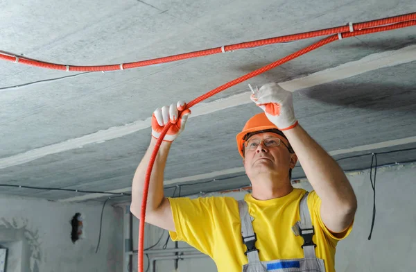 Electrician Fixing Electric Corrugated Tube Ceiling — Stock Photo, Image