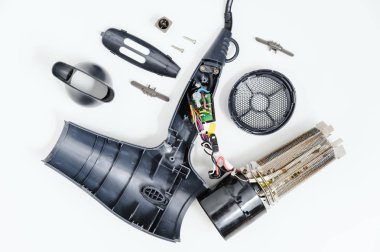 Hairdryer in a disassembled condition on a white background. clipart