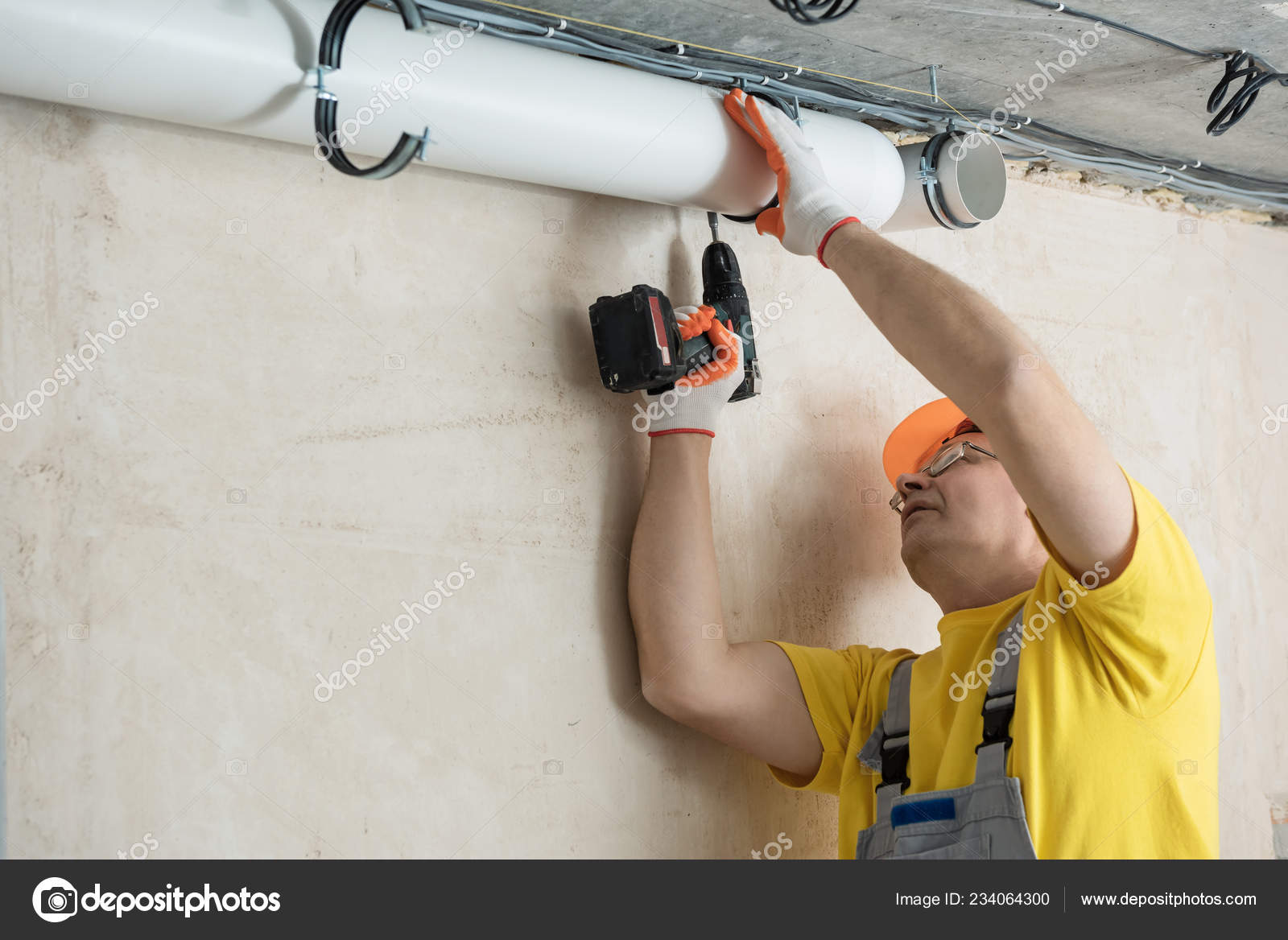 Worker Fixing Ventilation Pipes Ceiling Screwdriver Stock Photo