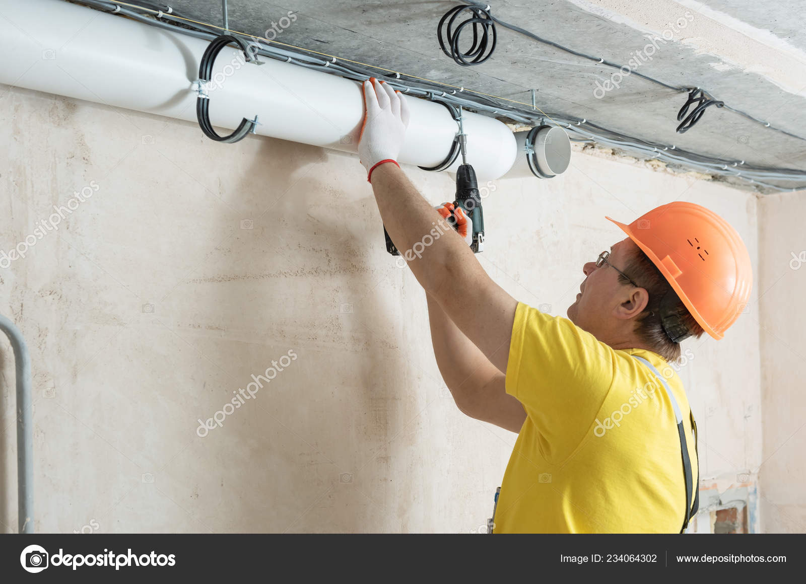 Worker Fixing Ventilation Pipes Ceiling Screwdriver Stock Photo