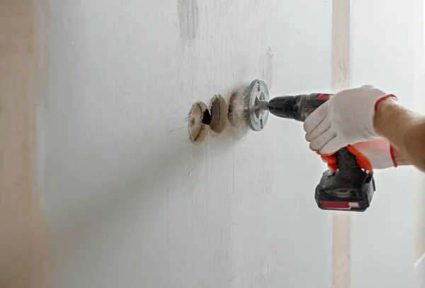 Making holes in the drywall. — Stock Photo, Image