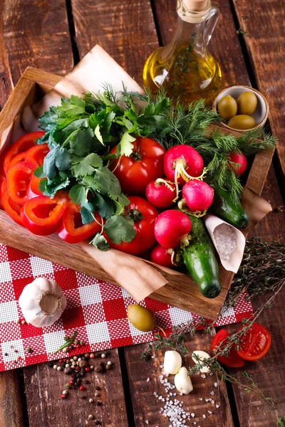 Box with vegetables-cucumbers, radishes and peppers, bioproducts — Stock Photo, Image