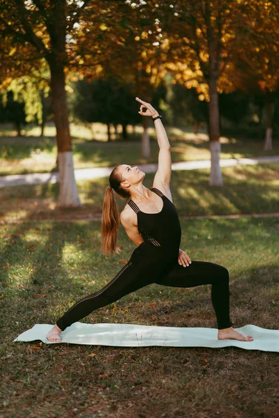 Young girl doing yoga in an outdoor Park