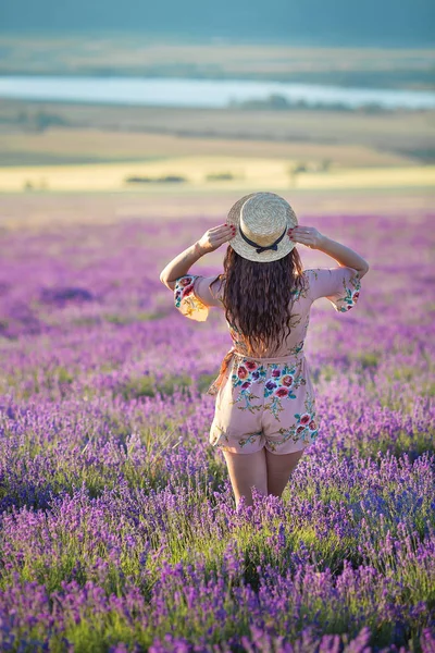 Young magic adorable woman in lavender field on summer day dancing and enjoy life time with woman girl power.