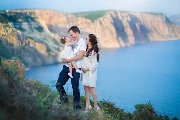 Couple family traveling together on cliff edge man and woman lifestyle concept summer vacations outdoor Crimean mountain top