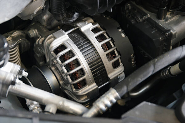 Belt driven power generator on the modern car engine 