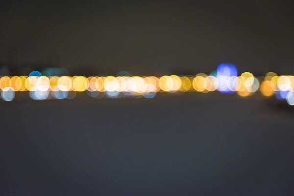 Blurred Photo, cityscape at twilight time, Traffic lights of the night city road.